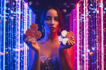 A cheerful woman in traditional clothing using her smartphone during a festive moment, showing how easily the 3333DET app fits into everyday life.